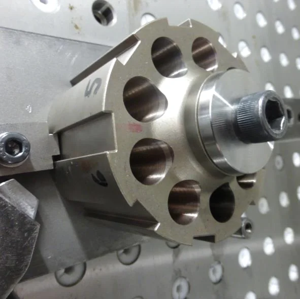 Hydraulic piston pump component secured in a machining fixture