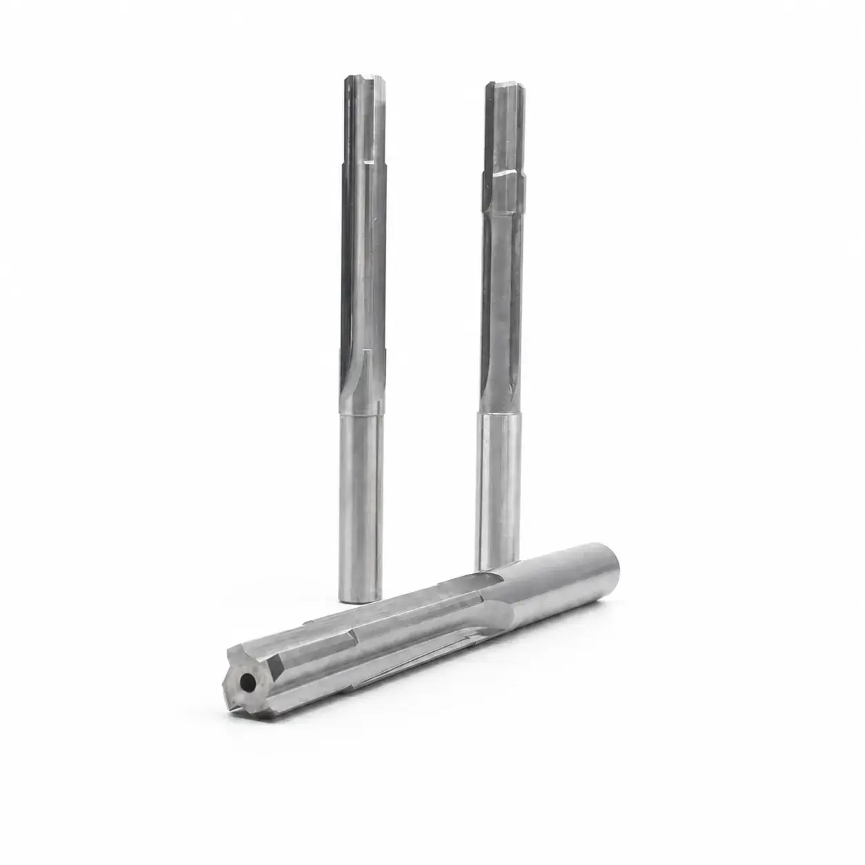 Three custom carbide reamers including a centre-through-coolant blind-hole reamer
