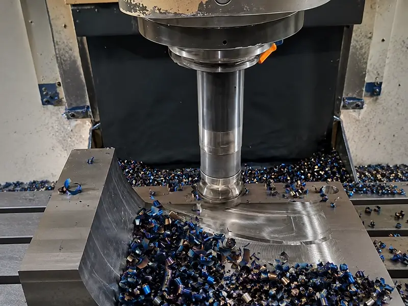 CNC roughing cut with heavy chip evacuation illustrating metal removal rate