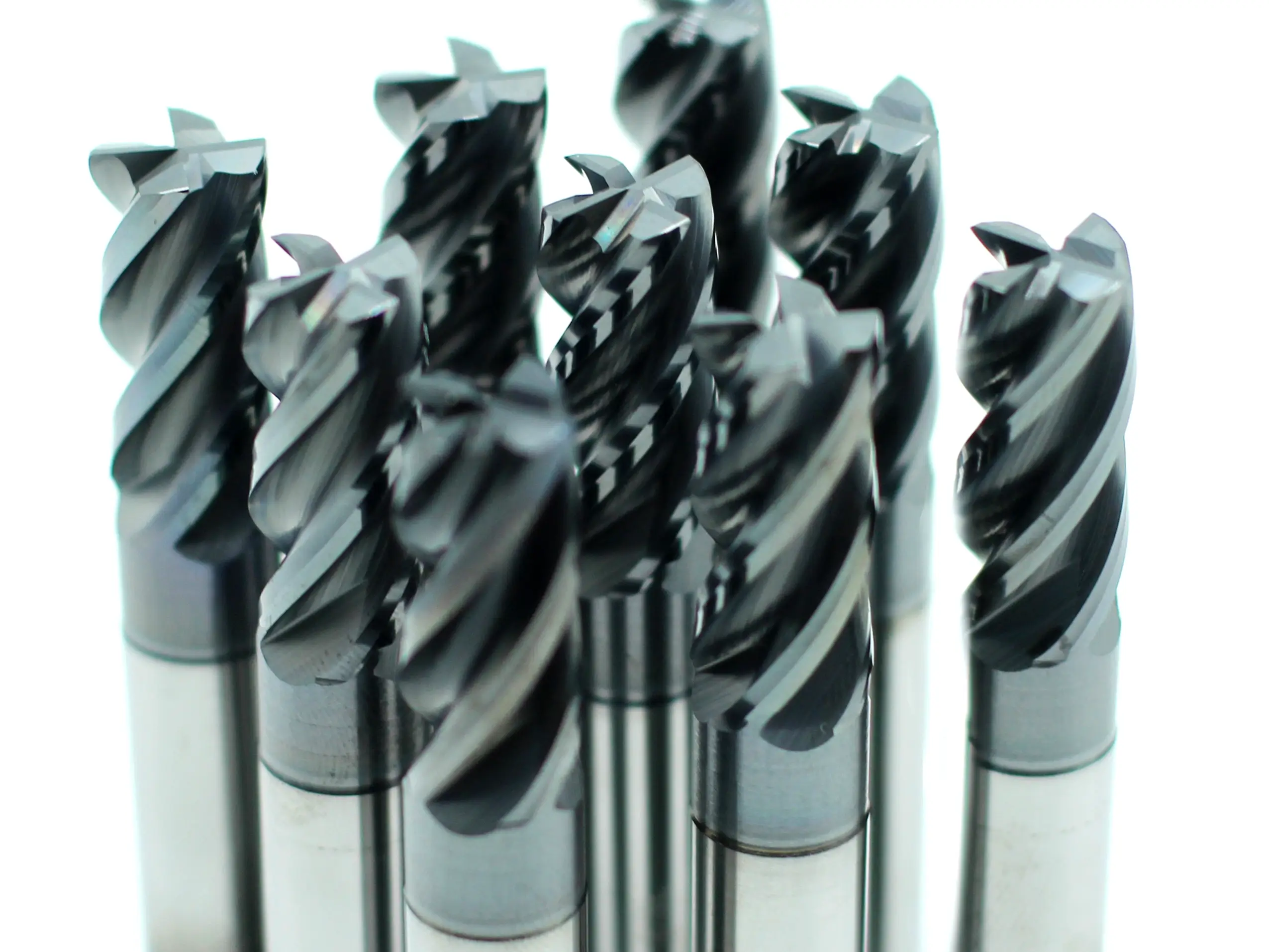 Coated carbide end mills with different flute geometries for helix angle selection