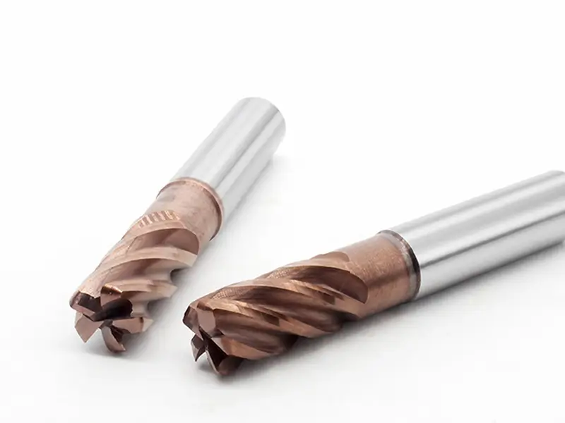 Four-flute carbide end mills for pocket milling and controlled chip evacuation
