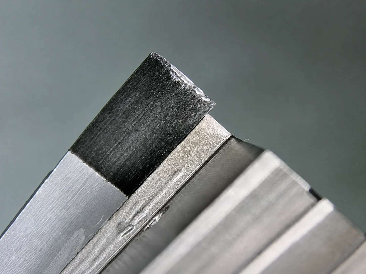 Close view of a cutting-tool edge for wear inspection.