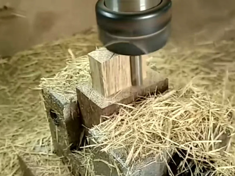 Cutting wood with visible formed chips around the tool
