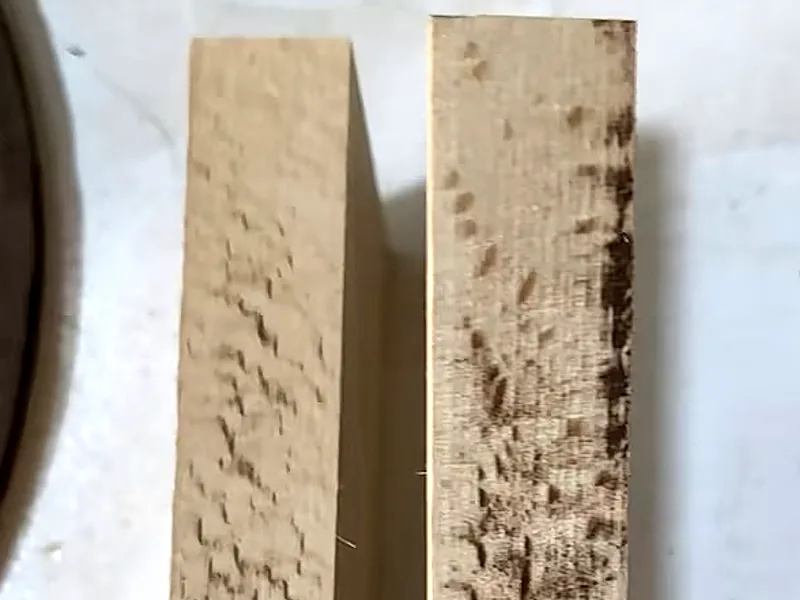 Two rough wooden edges with darkened areas