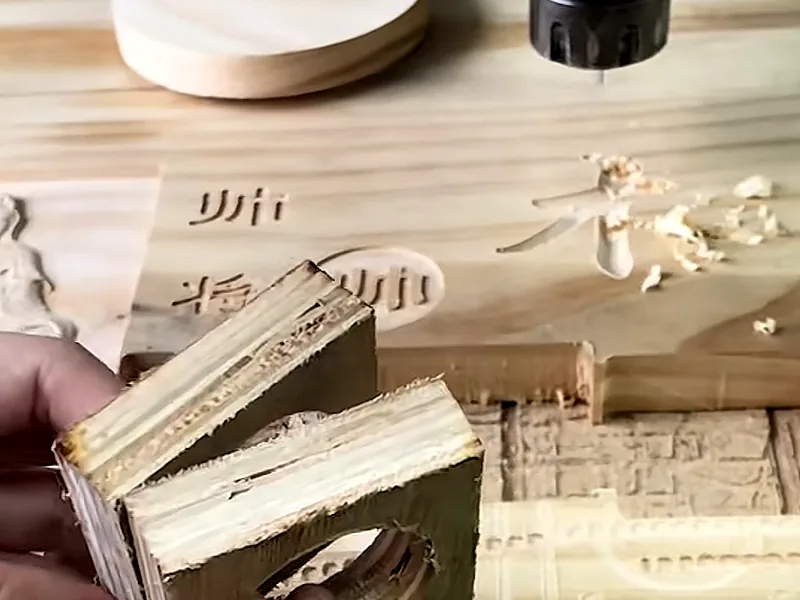 A wooden routed profile shown near a machine